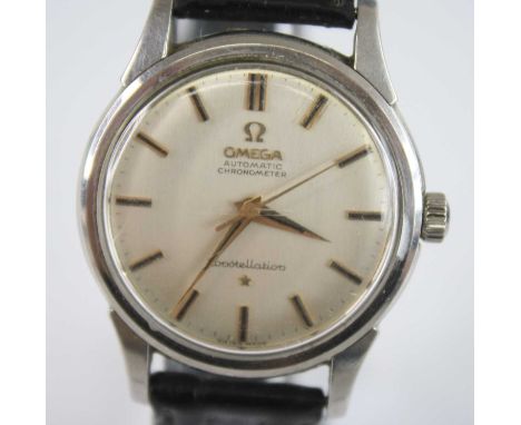 A stainless steel Omega Constellation automatic chronometer wristwatch, with round silver baton dial, fitted to a black leath