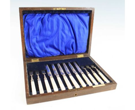 A cased set of six Edwardian silver and mother of pearl handled fruit knives and forks,  the ferrules having banded and beade