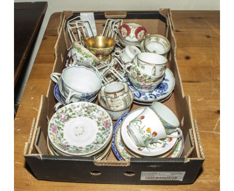 A box containing porcelain cups and saucers (trios)