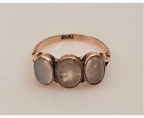 A three stone moonstone ring, set with three graduated moonstone cabochons, stamped 9ct, ring size O, weight approx. 2.9g, (A