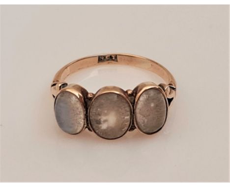 A three stone moonstone ring, set with three graduated moonstone cabochons, stamped 9ct, ring size O, weight approx. 2.9g, (A