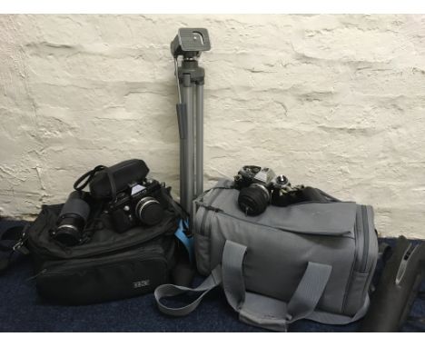 A selection of camera equipment to include Praktica LLC camera, Ozeck lens, tripod, Olympus OM10 with flash, etc. IMPORTANT: 