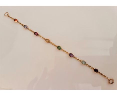 A multi-gemstone bracelet, the curb link chain bezel set with various oval cut gemstones to include amethyst and garnet, stam