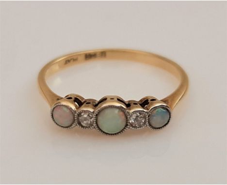 An opal and diamond five stone ring, set with alternating round opal cabochons and single-cut diamond accents, stamped 18ct P