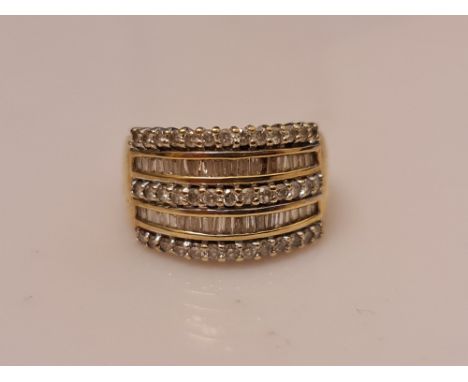 A hallmarked 9ct yellow gold five row diamond half eternity ring, set with five rows of alternating round brilliant cut and t