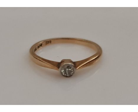 A diamond solitaire ring, set with a round brilliant cut diamond measuring approx. 0.10ct, stamped 9ct, ring size N, weight a