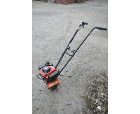 A HONDA 4 STROKE PETROL GARDEN ROTAVATOR (engine pulls freely)