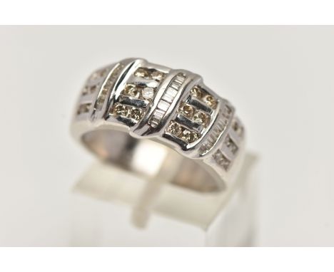 A 9CT WHITE GOLD DIAMOND DRESS RING, designed as three horizontal rows of round brilliant cut diamonds, with three rows of ba