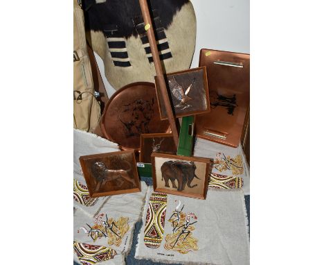 A GROUP OF 1970S TRIBAL SOUVENIRS, comprising an animal hide shield of elliptical form, a spear and two sticks, two coppered 