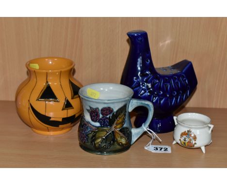 A GROUP OF MOORCROFT POTTERY, comprising a 'Bramble' design mug (cracked and crazed), a Pumpkin vase painted and impressed ma