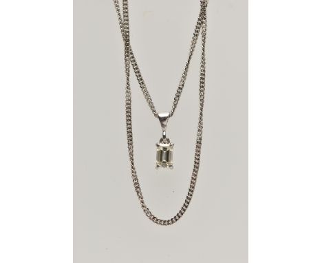 A DIAMOND PENDANT NECKLACE, the emerald cut diamond within a four claw setting suspended from a curb link chain, estimated di