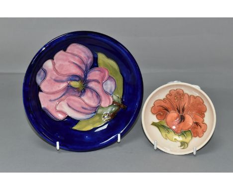 TWO MOORCROFT POTTERY BOWLS, comprising a small footed bowl, decorated in Coral Hibiscus pattern on a cream ground, diameter 