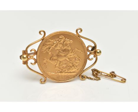 A MOUNTED FULL SOVEREIGN COIN, Queen Victoria, George and The Dragon, dated 1887, fitted onto a scroll mount with brooch pin 