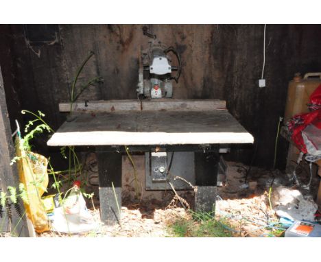 A VINTAGE DeWalt RADIAL ARM SAW with 24in cut on a steel framed base with four drawers to side width 122 depth 115 height 136