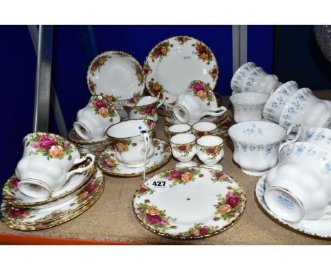 TWO ROYAL ALBERT TEA SETS, 'MEMORY LANE' AND 'OLD COUNTRY ROSES' PATTERNS, comprising eight cups, five saucers and four tea p