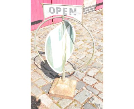 A VINTAGE CASTROL REVOLVING GARAGE ADVERTISING SIGN with circular sun bleached sign stating Castrol Oil to both sides, chrome