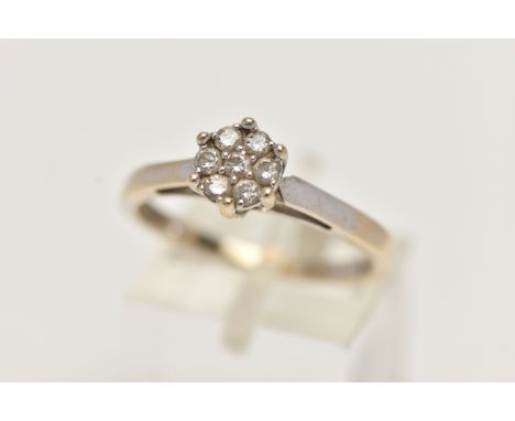 A WHITE GOLD DIAMOND CLUSTER RING, small cluster of seven round brilliant cut diamonds, stamped diamond weight 0.25cts, polis