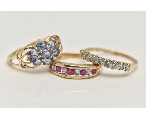 THREE 9CT GOLD GEM SET RINGS, to include a ruby and diamond half eternity ring, hallmarked 9ct London, ring size L, a cubic z