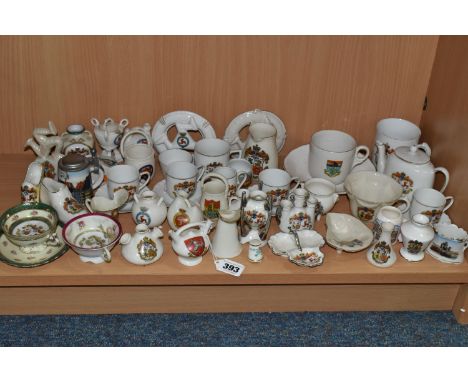A COLLECTION OF CRESTED WARES, approximately fifty pieces, many related to the Isle of Man, to include cups and saucers, Isle