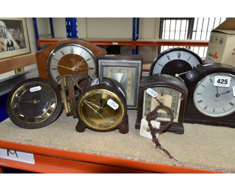 A GROUP OF CLOCKS, comprising four 1930's Smith Sectric clocks, a Temco Bakelite electric clock by Telephone MFG. Co. Ltd., a