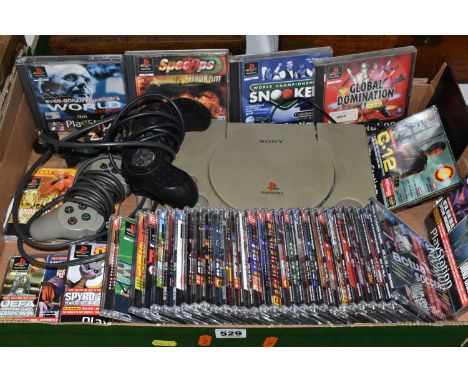 A PLAYSTATION CONSOLE WITH GAMES AND DEMO DISCS, includes demos for Crash Bandicoot 2, Crash Bandicoot 3 Warped, Spyro The Dr