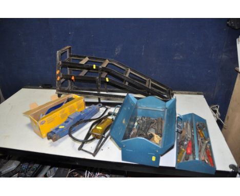 A SELECTION OF AUTOMOTIVE TOOLS, to include a pair of car ramps, two foot pumps, a scissor jack and a metal toolbox with span