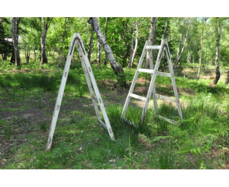 A PAIR OF VINTAGE A FRAME STANDS with rungs to both sides standing height 186cm width at base 83cm (these items are offsite a