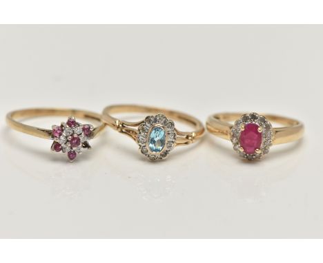 THREE 9CT GOLD GEM SET RINGS, to include a topaz and diamond cluster, ring size O, a ruby and diamond oval cluster, ring size