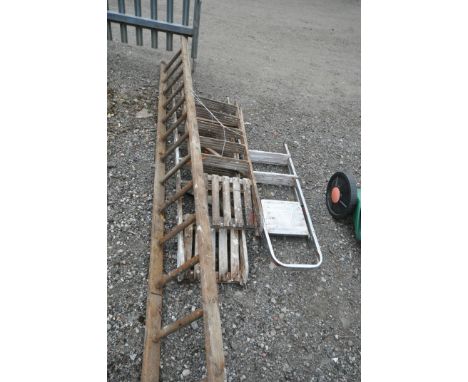 FOUR VARIOUS SETS OF LADDERS, to include one aluminium step ladder, two wooden step ladders, and a section of an extension la