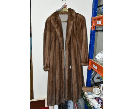 A LADIES  MID LENGTH FUR COAT, pastel brown, maker's name Subhashini, approximate UK size 12 (1) (Condition report: lining, p