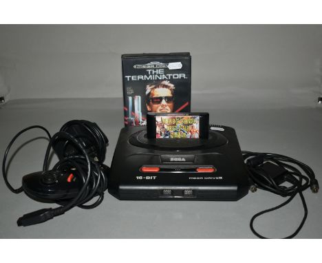 SEGA MEGADRIVE CONSOLE AND GAMES, includes Terminator (boxed) and Mega Games 2 (loose), console powers up when tested, howeve