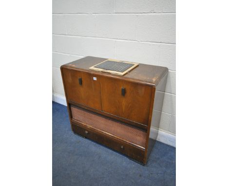 AN ART DECO PYE WALNUT VALVE RADIOGRAM, Type P35 RG, and a Garrard rc72 brown Bakelite turntable, a spare non fitting glass p