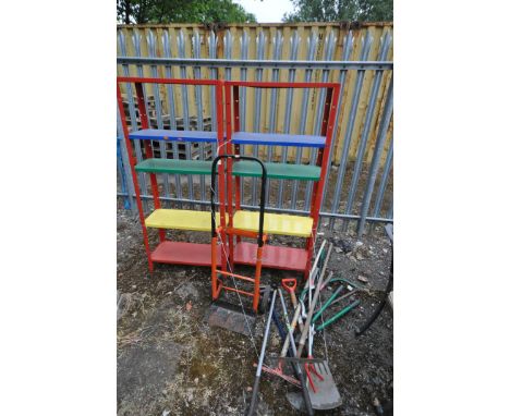 TWO MULTI COLOURED SHELVING UNITS, along with a selection of garden tools and a sack truck (condition:-shelving with peeling 