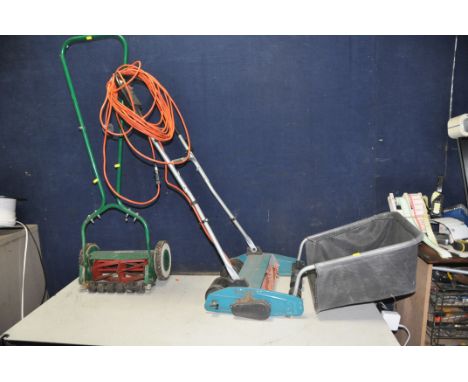 A QUALCAST MANUAL CYLINDER LAWN MOWER, and a Black and Decker lawn raker with collection box (PAT fail due to uninsulated plu