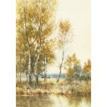 J. E. Grace (1851-1908) British, A river scene with reeds and trees and cows in a field beyond,