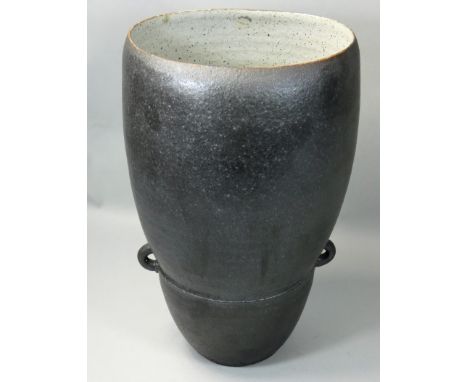 David Lloyd-Jones (1928 - 1994), a twin handled vase with a speckled ebony glaze, mottled cream interior, impressed makers ma