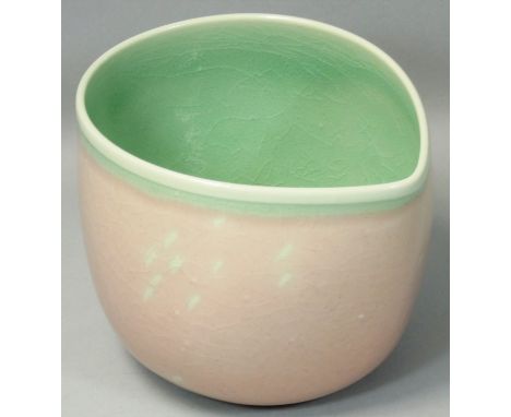 Caroline Whyman, a crackle glazed pouring jug in light pink glaze, celadon interior and rim, impressed makers initials, heigh