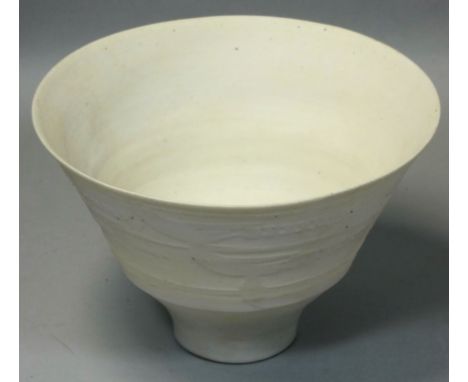 David Leach OBE (1911 - 2005), a porcelain footed bowl, unglazed, relief scroll decoration raised on a small conical foot, im