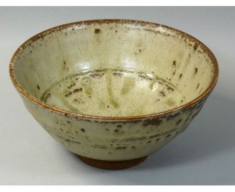 Richard Batterham (b.1936), a porcelain bowl with green ash glaze, raised on a small conical foot, Dorset, c. 1965, height 8.