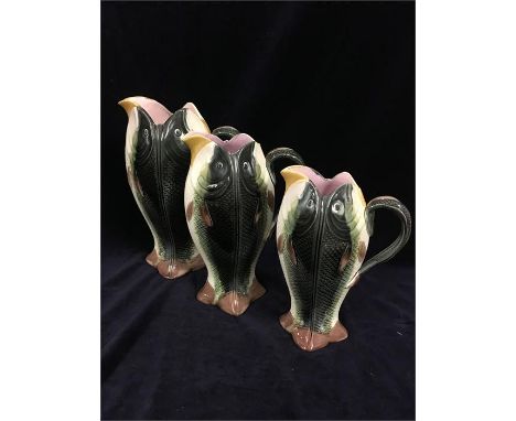 A set of three ceramic Fish jugs