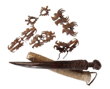 A COLLECTION OF DIFFERENT SIZED SUMBA MAMULI&nbsp;and a carved wood songye virgin stick in sheath (a lot)