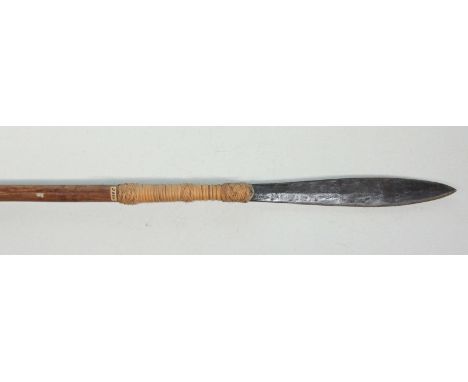 A hunting spear, possibly Indonesian, with leaf-shaped double-edged blade, rattan-bound to the rustic haft with wrought-iron 