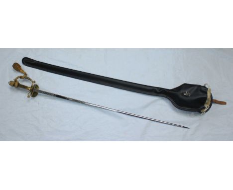 A Wilkinson Sword court sword with 31.5" burnished blade, clam-shell guard, with scabbard and vinyl slip case