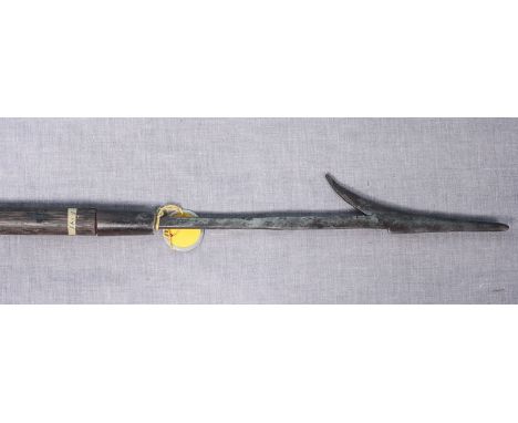 An early 20th century hunting/ fishing spear, possibly Philippines, the hand-forged spear point with single barb and rectangu
