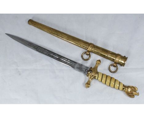 A WW2 Third Reich Kriegsmarine Officers dress dagger, with brass eagle pommel, wire twist ivory handle and etched double full