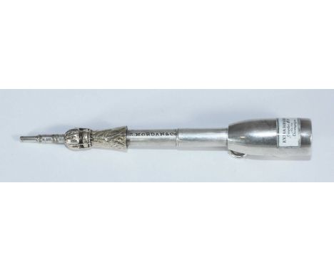 A Victorian white metal propelling pencil by Sampson Mordan &amp; Co. modelled as a champagne bottle with enamel label readin