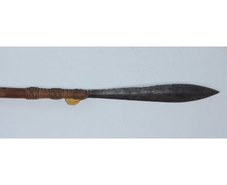 A hunting spear, possibly Indonesian, with leaf-shaped double-edged blade, rattan-bound to the rustic haft with wrought-iron 