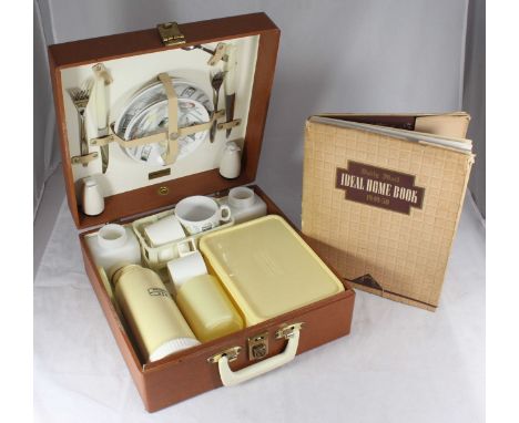 A Brexton picnic hamper containing two-each 'Fiesta' Barker Bros plates, cups and saucers, knives &amp; forks, various Tupper