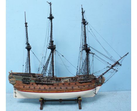 A planked and pinned wooden scale model of a twin-mast 19th century whaler, 90cm, together with a large wooden model of an 18