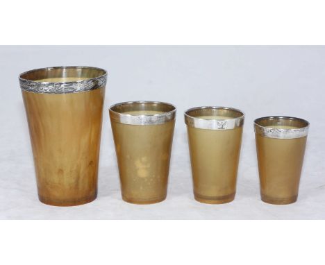 A set of four graduated horn hunting beakers, each with silver mounted rims by Louis Dee, hallmarked London, 1880.